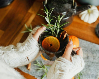 Woman holding a cup of lemon ginger tea