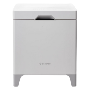 White Carepod humidifier with a minimalist square design and grey base