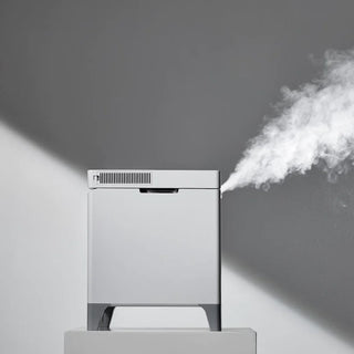 Carepod Cube X50 Warm + Cool Mist Stainless Steel Humidifier emitting mist