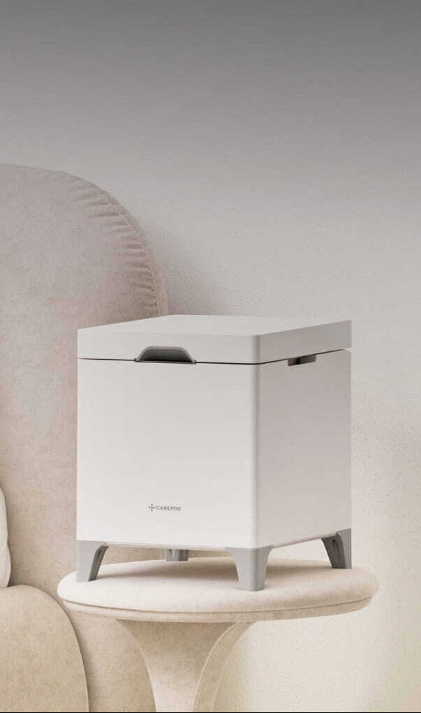 Carepod Cube humidifier on a light-colored stool